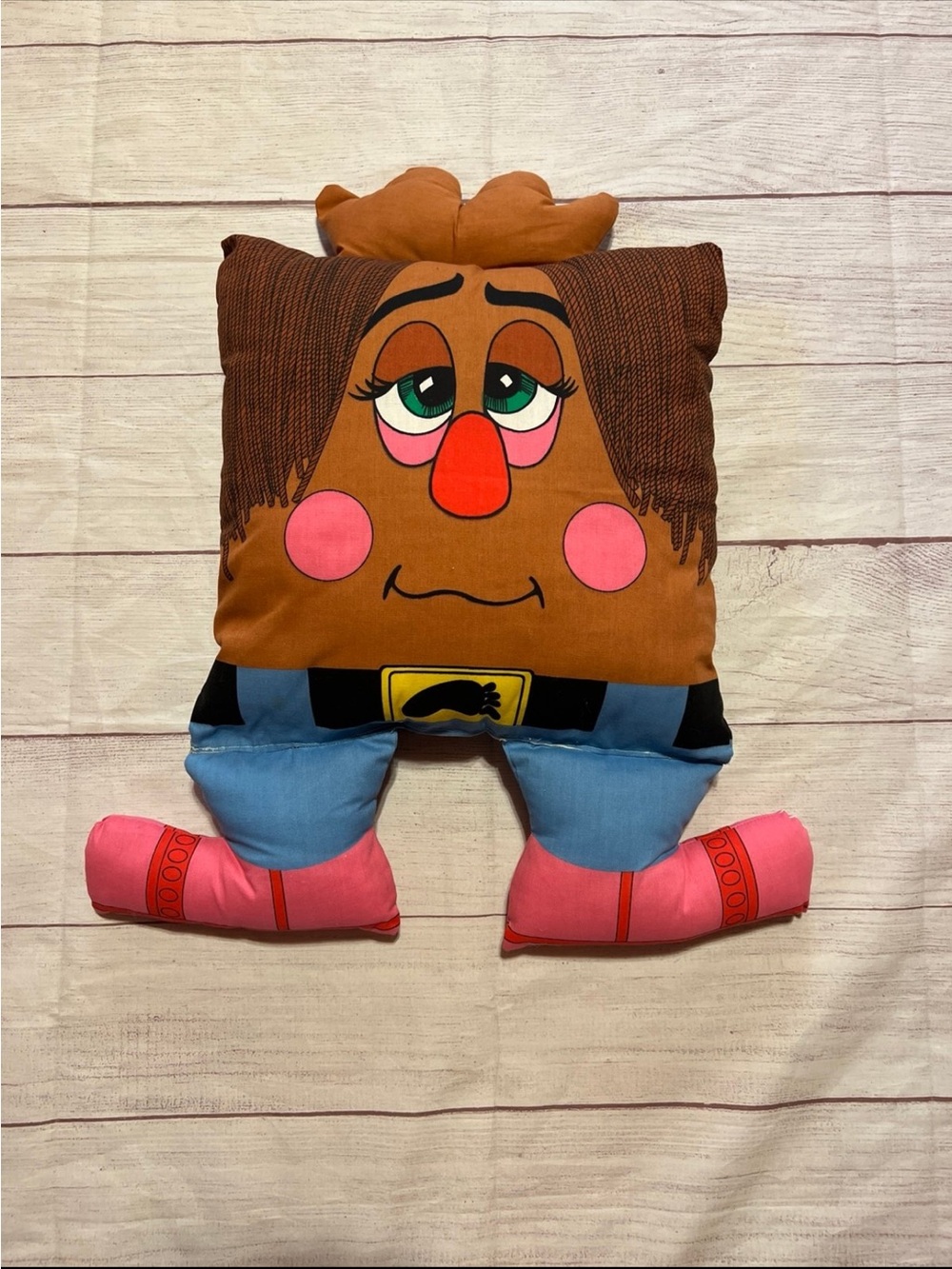 This is a 1980s 12” Pillow People plush character named Big Footsteps